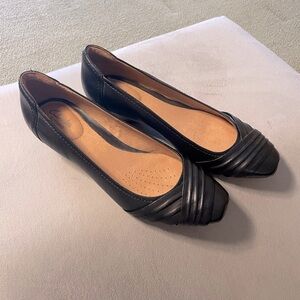 Cute low heel black wedges. New condition. No noticeable wear. 👀